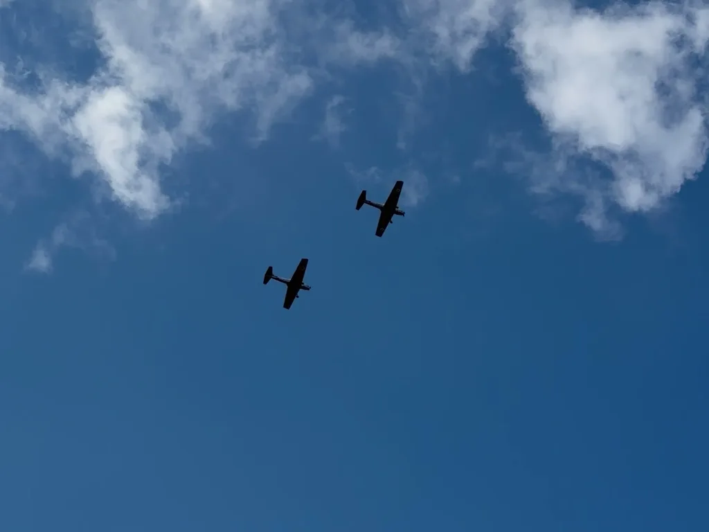 A pair of Chipmunks flying in formation over Fenland Airfield