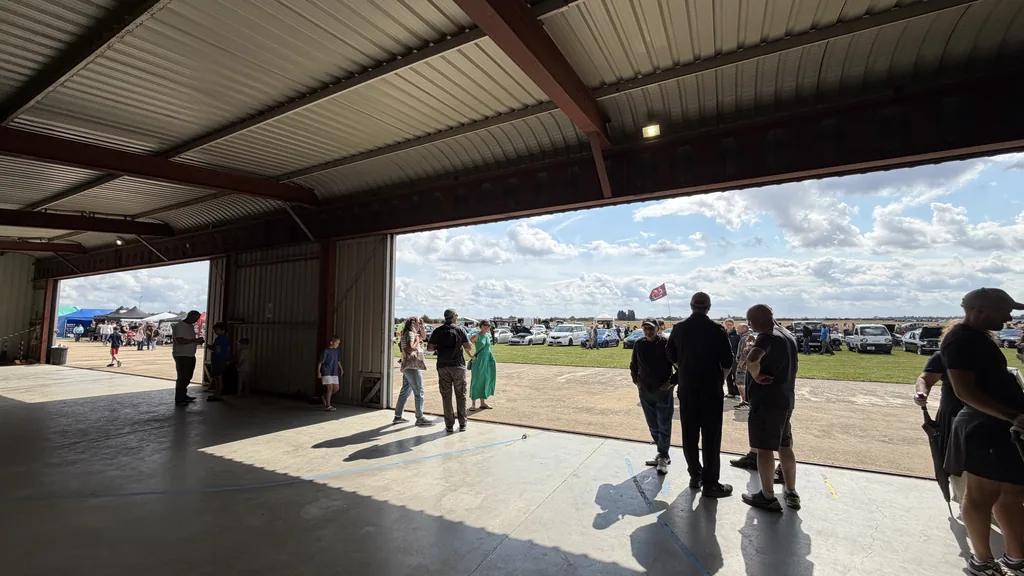 Looking out from the hangar across the display field and parked cars